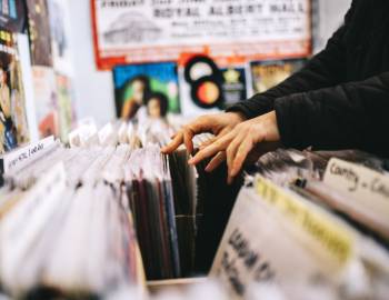 person browsing vinyl in record shop