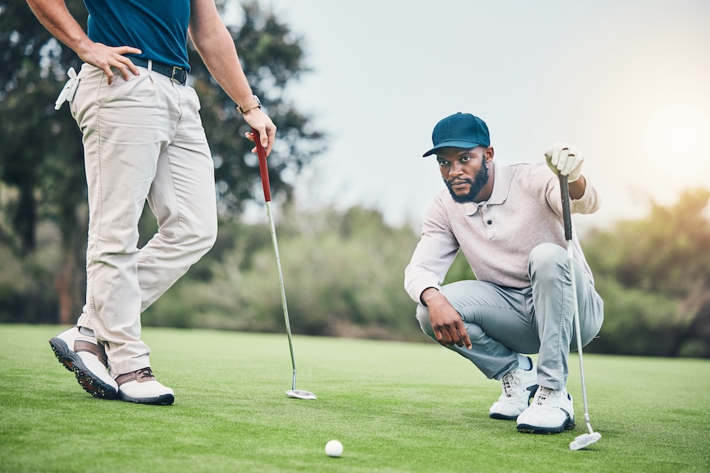 two men playing golf